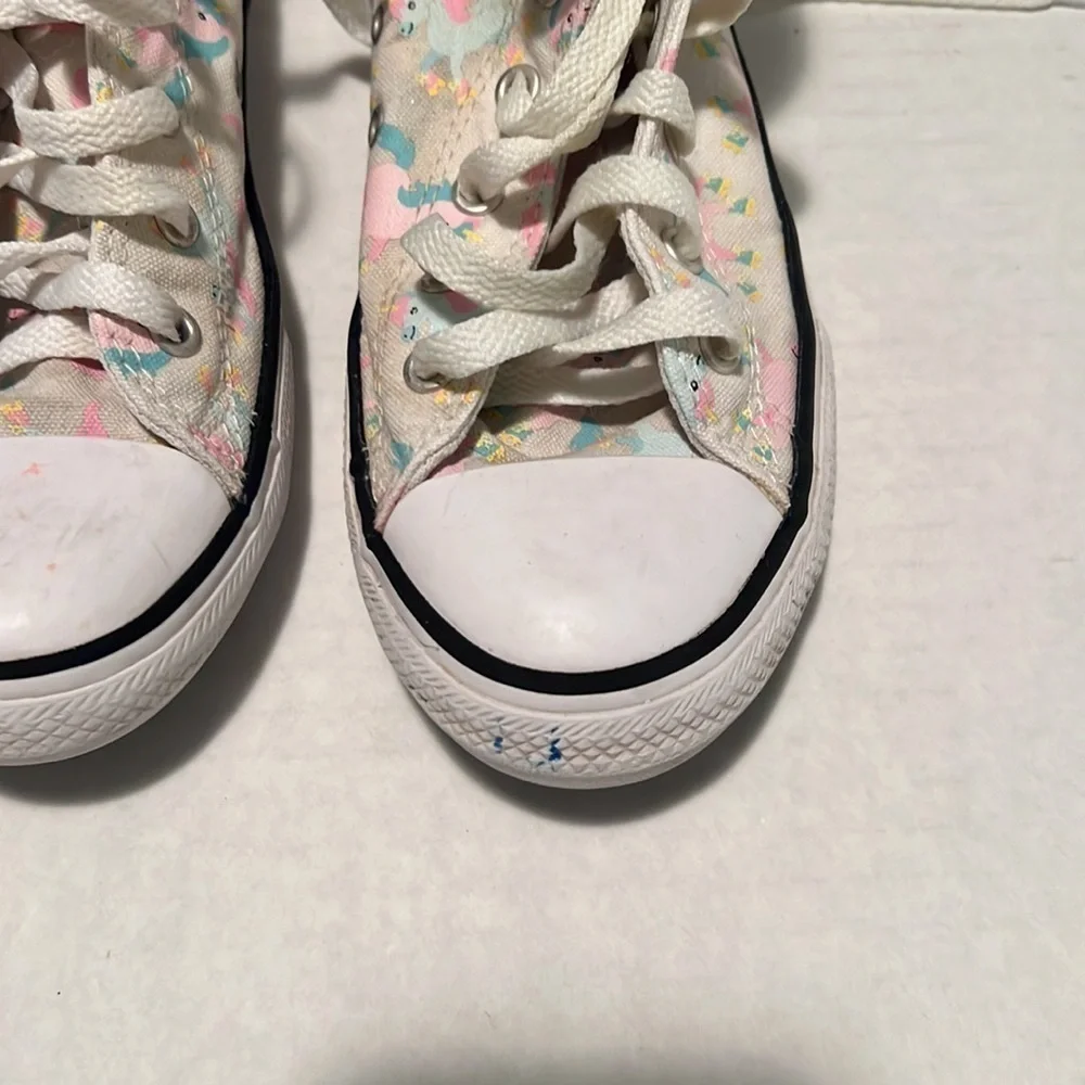 Converse unicorn high top tennis shoe.